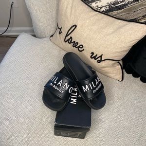 Milano women's slides size 37 colors are black and white.